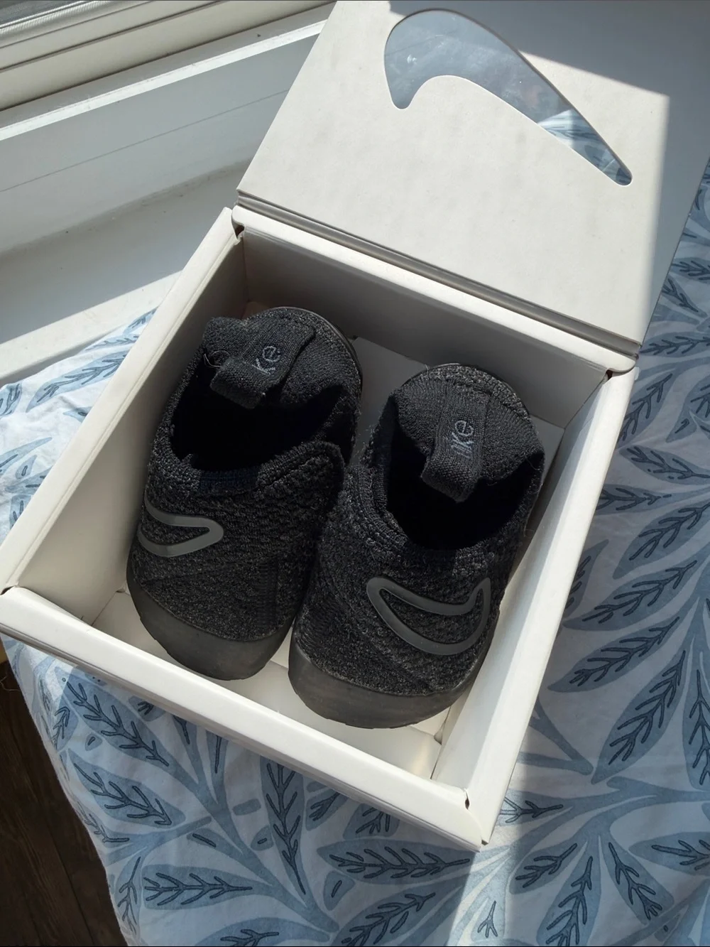 Nike White Box with Black Swoosh and Orange Outline